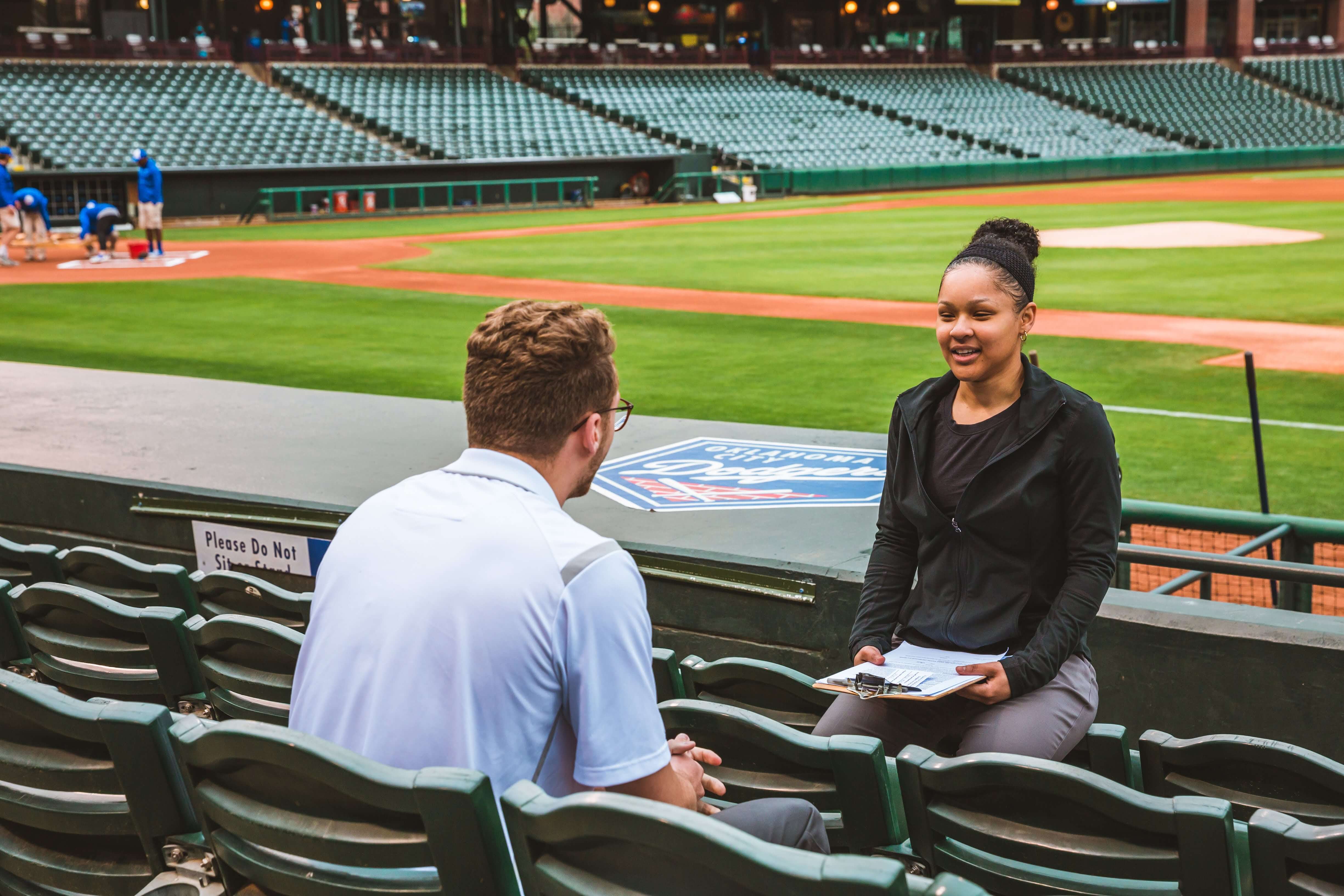 SNU Rehabilitation and Sport Sciences student on baseball field with OKC Dodgers
