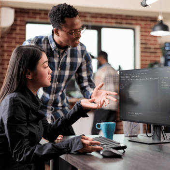 Cybersecurity Analysts Discussing Work