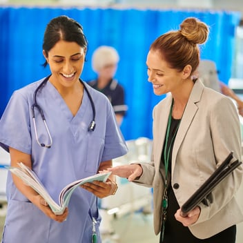 Healthcare Administrator Talking with Doctor