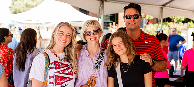 A family gathers during SNU New Student Institute to move in their student.