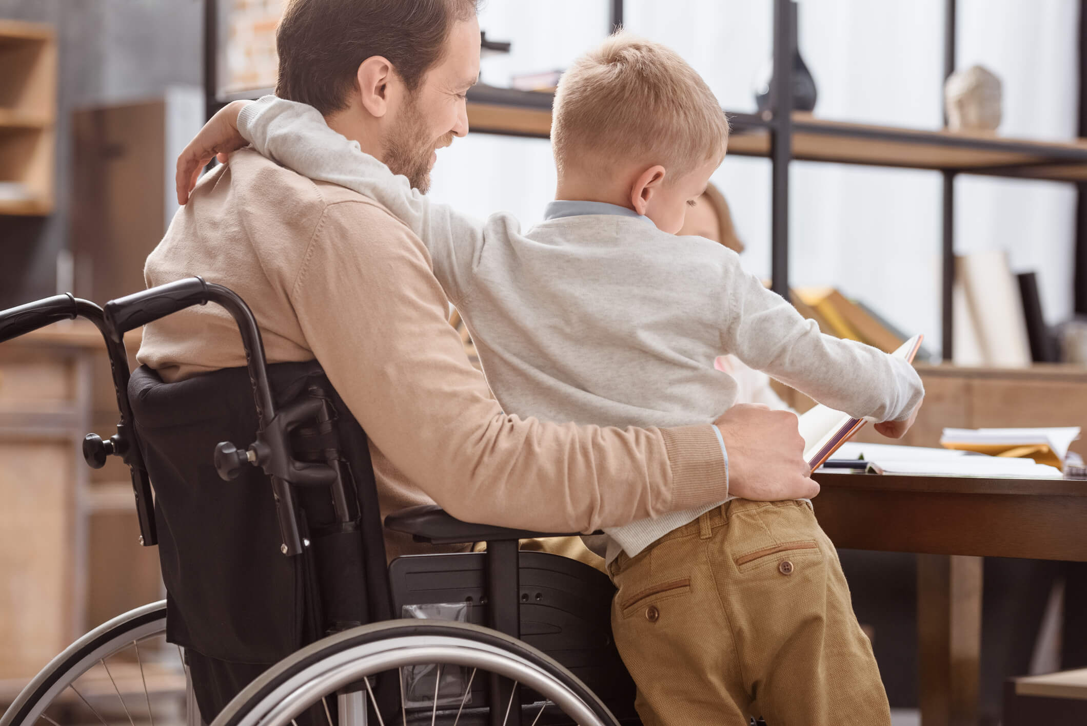 Disabled veteran hugging his son