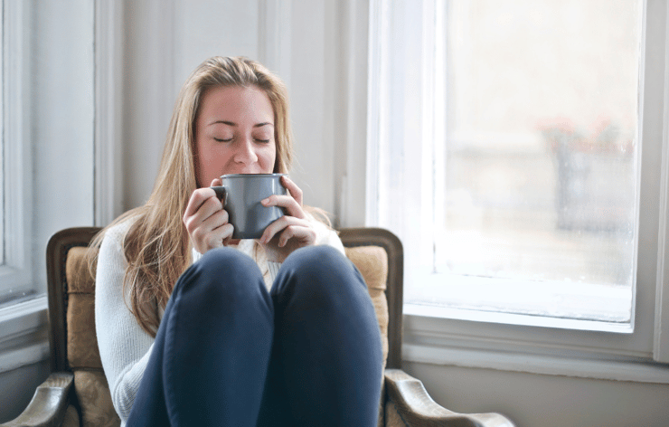 Adult student relaxing while drinking coffee