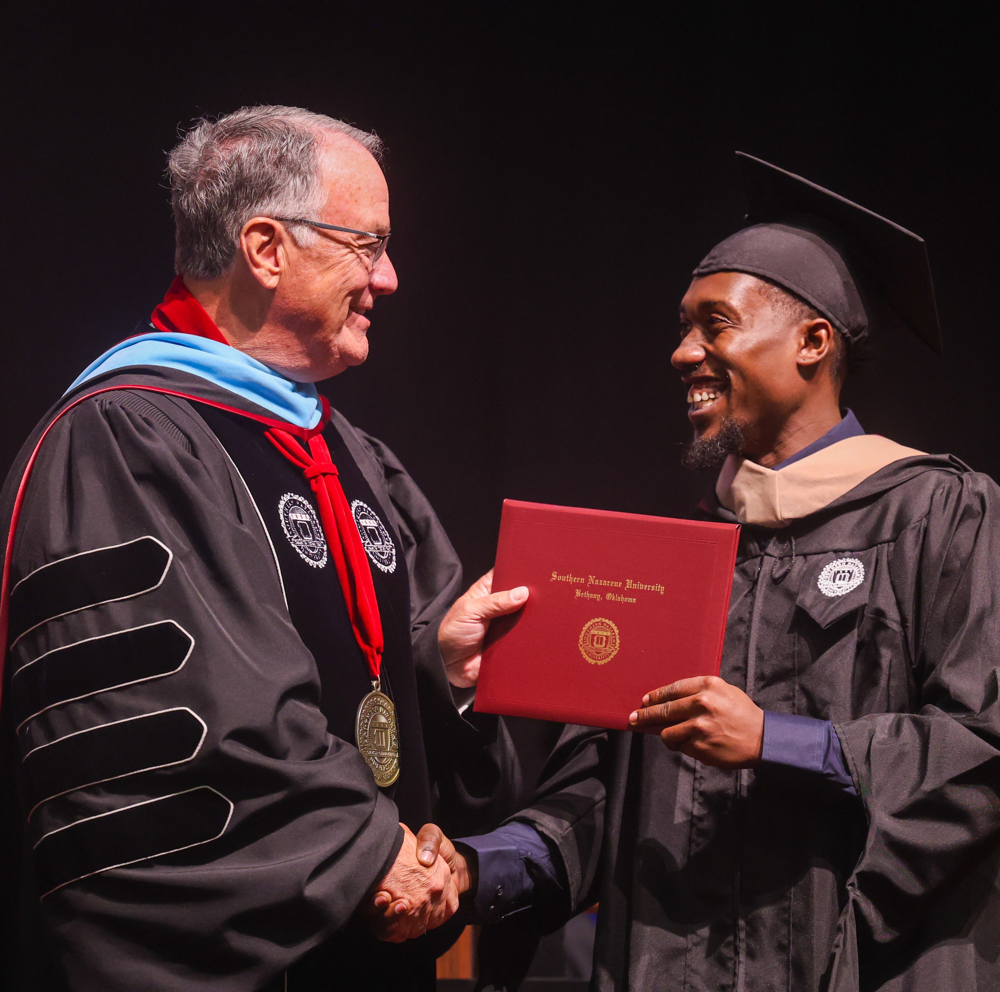 Dr. Keith Newman and a May 2025 Graduate