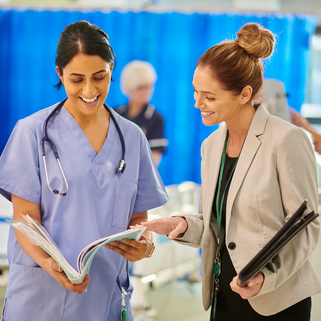 Healthcare Administrator talking to a Doctor