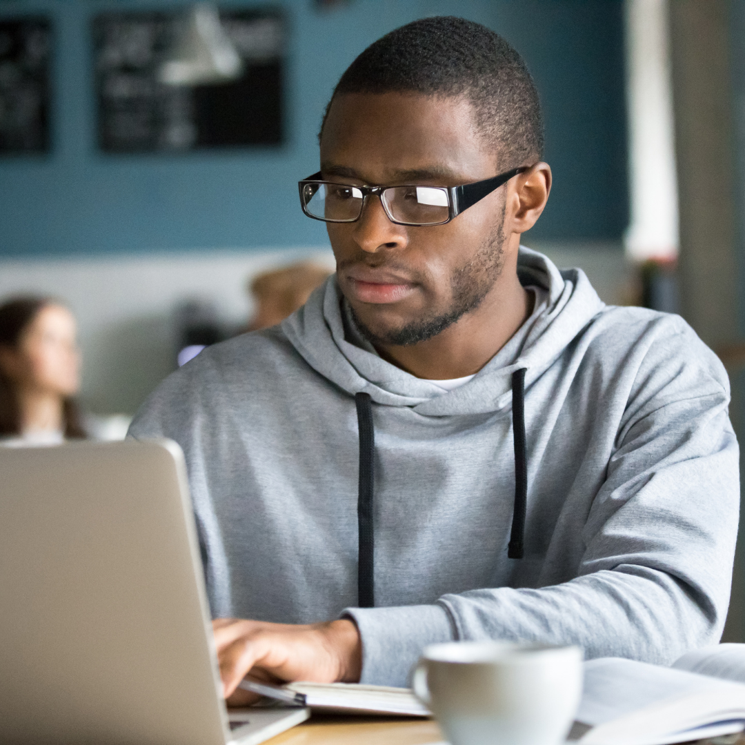 Male Student Working on Laptop