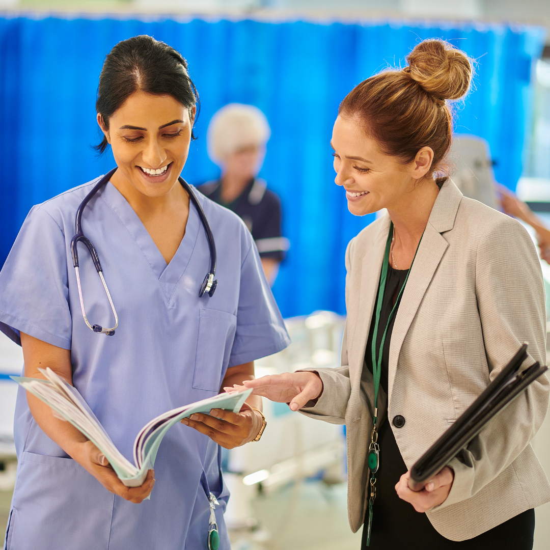 Healthcare Administrator Talking with Doctor