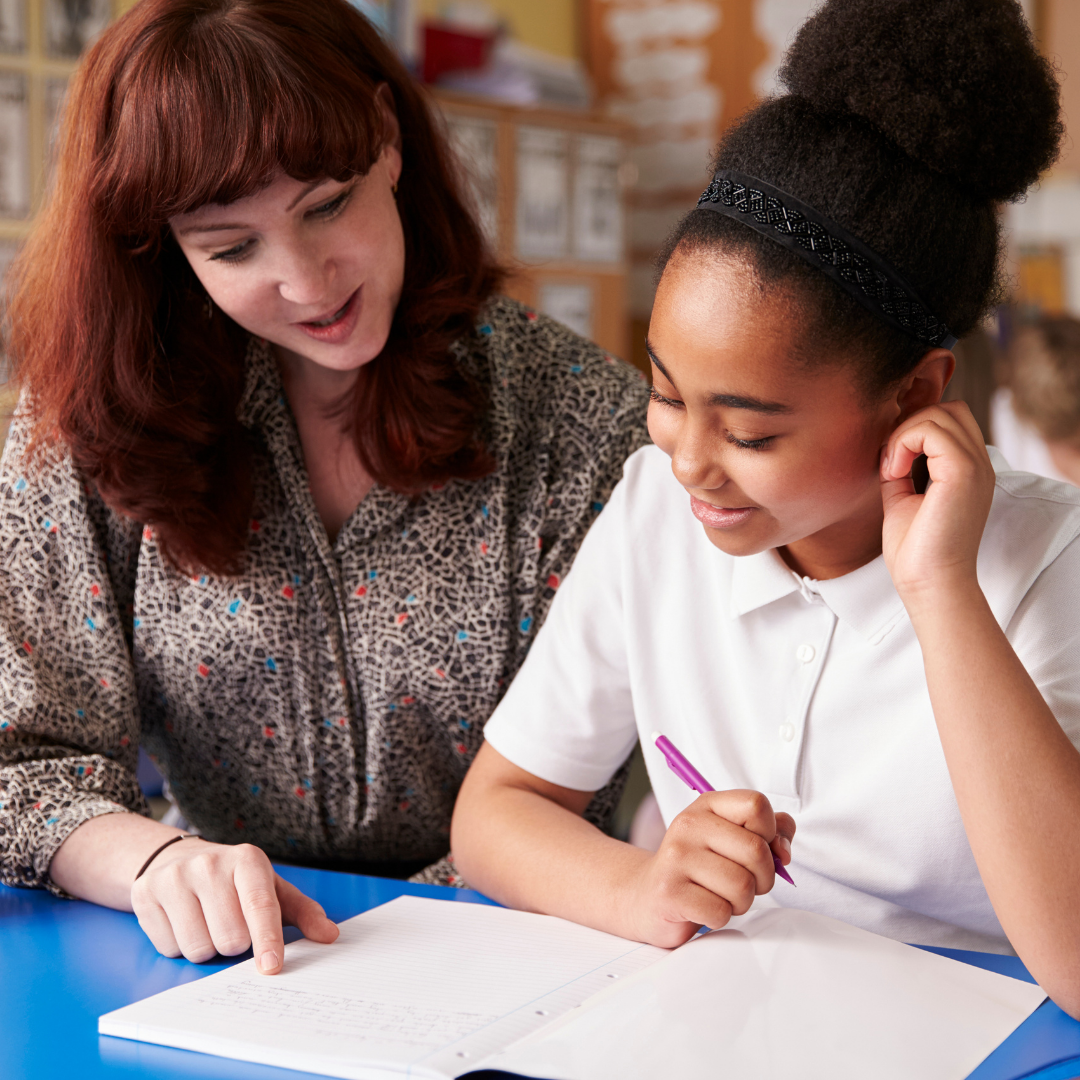 Special education leader working with a student.
