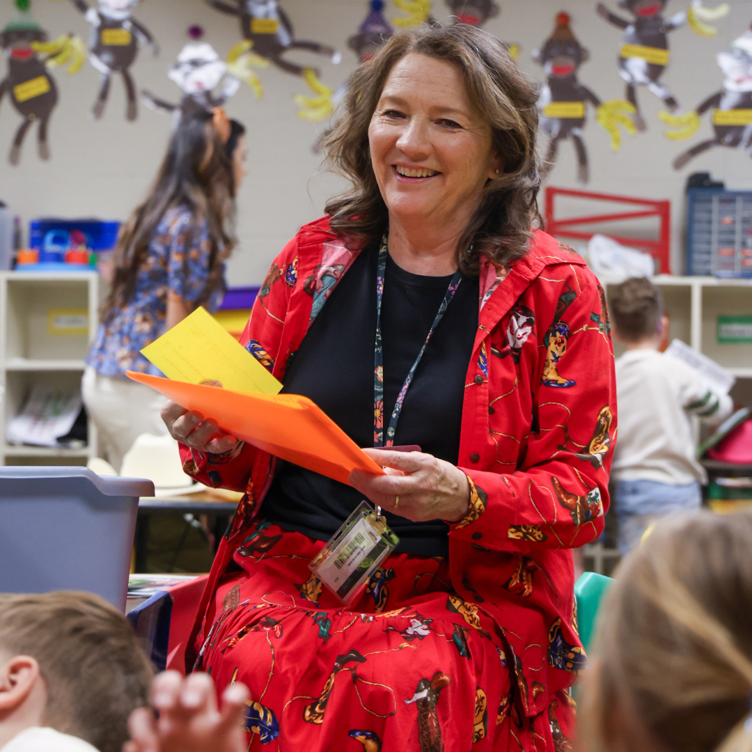 Teacher in a classroom interacting with students