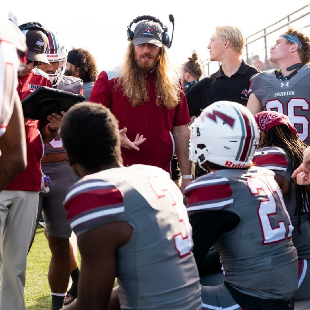 College Football Coach Talking to Players