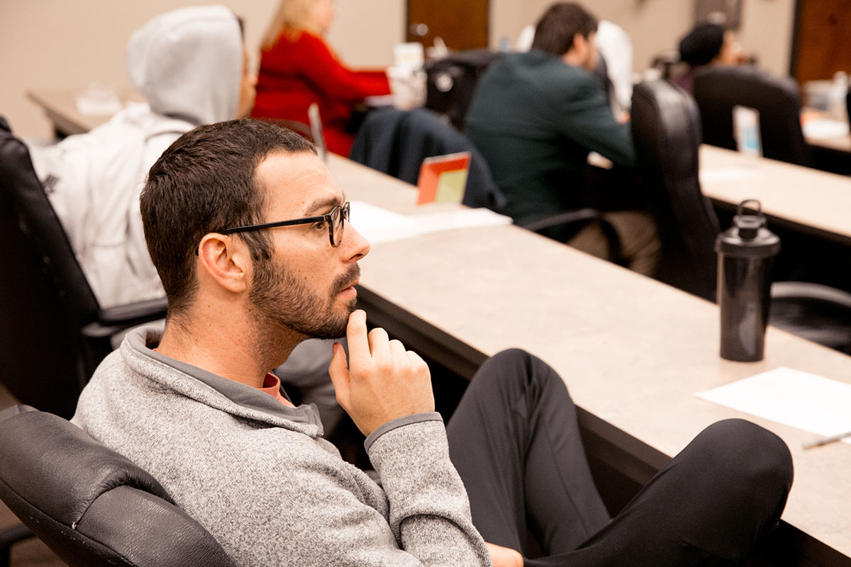 Student listens to lecture in class