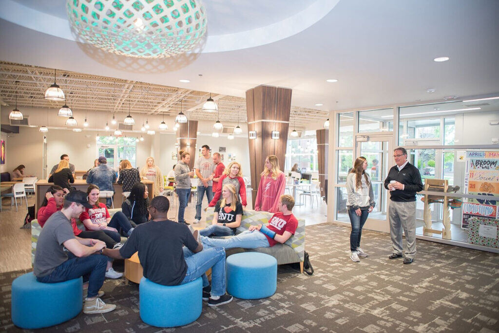 crowd of students in a campus common area