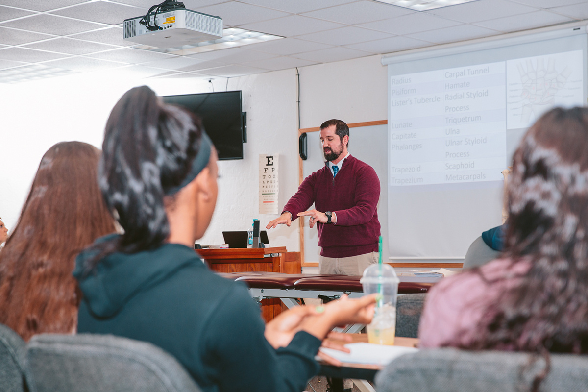 sports management professor teaching in class