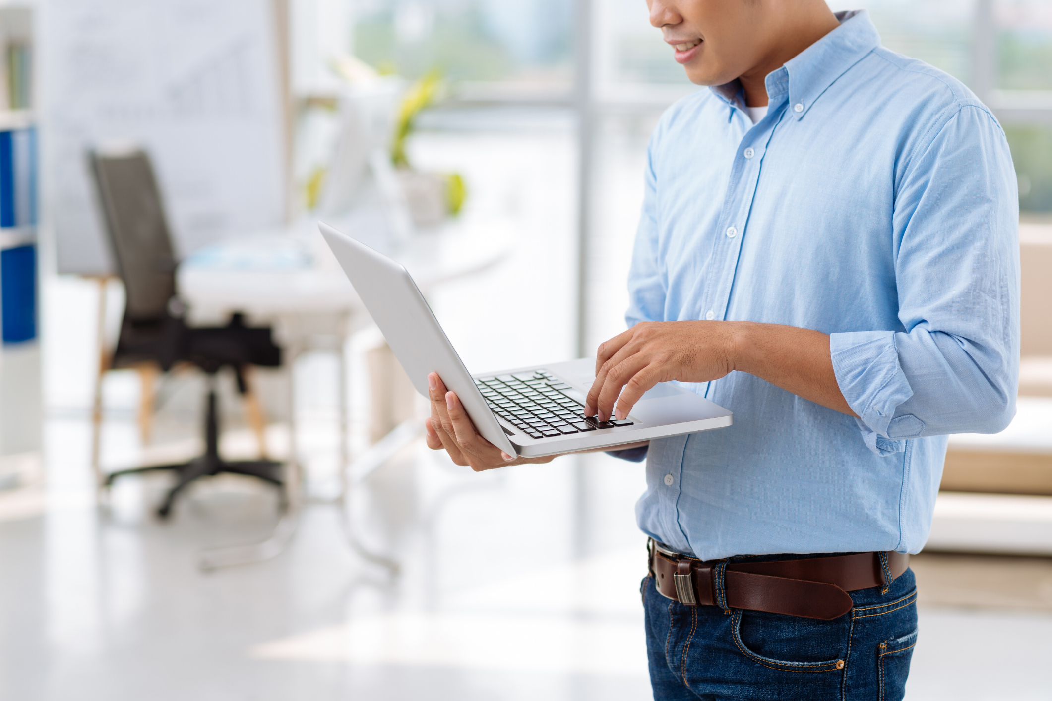 man holding a laptop