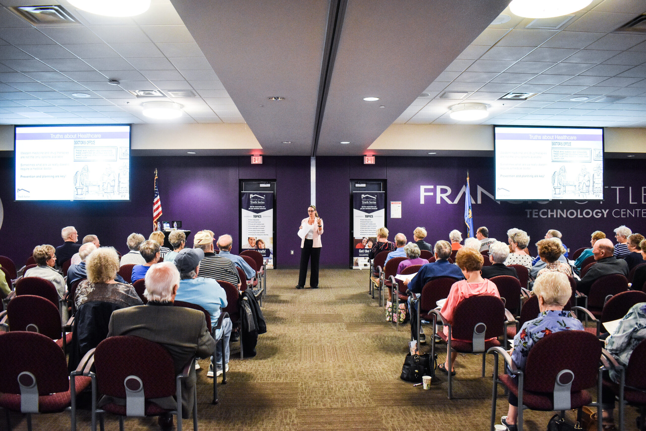 Nikki Buckelew Speaking in front of a crowd