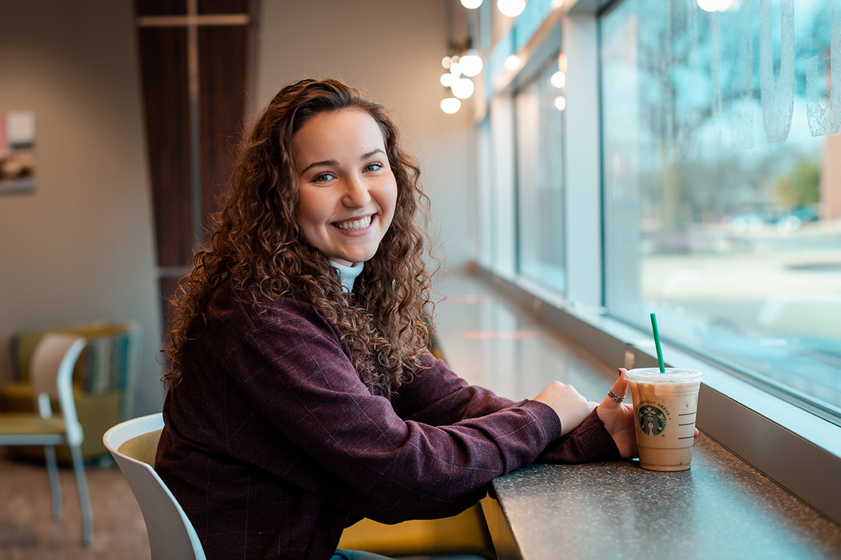 student sitting in coffee shop