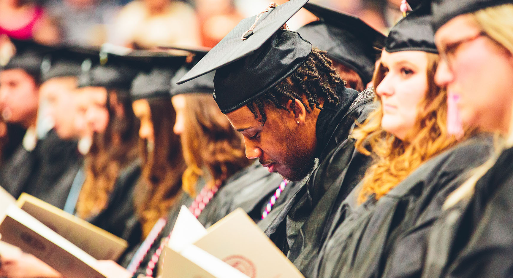 Graduates sitting at Commencement