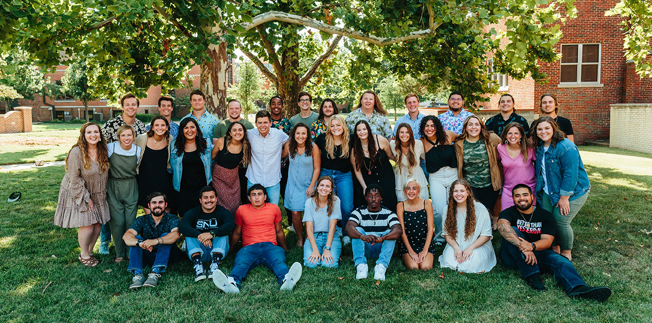 Group of students smiling on campus