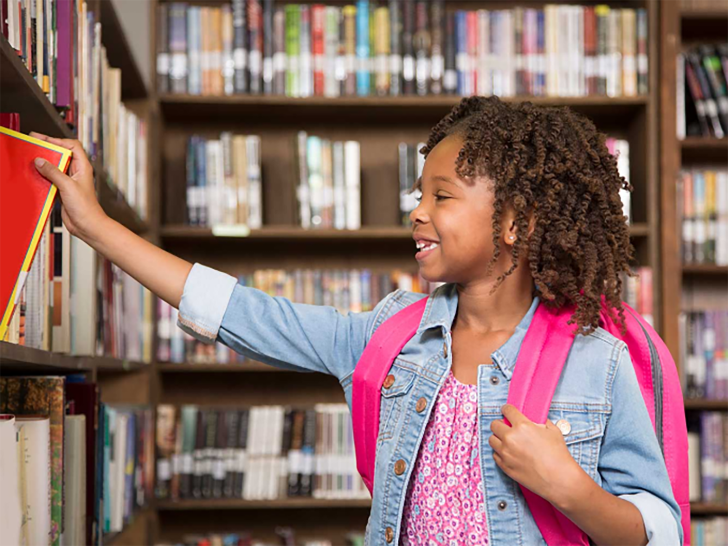 student with library books