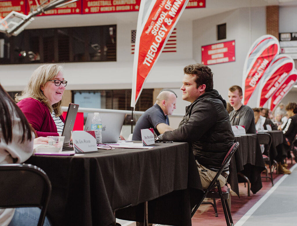 faculty advising a student during priority enrollment event